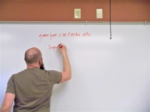 Taylor University professor Jon Denning writing important information for students start building their games. Photo copyright 2019 by Gabriel Connor Salter. All rights reserved.